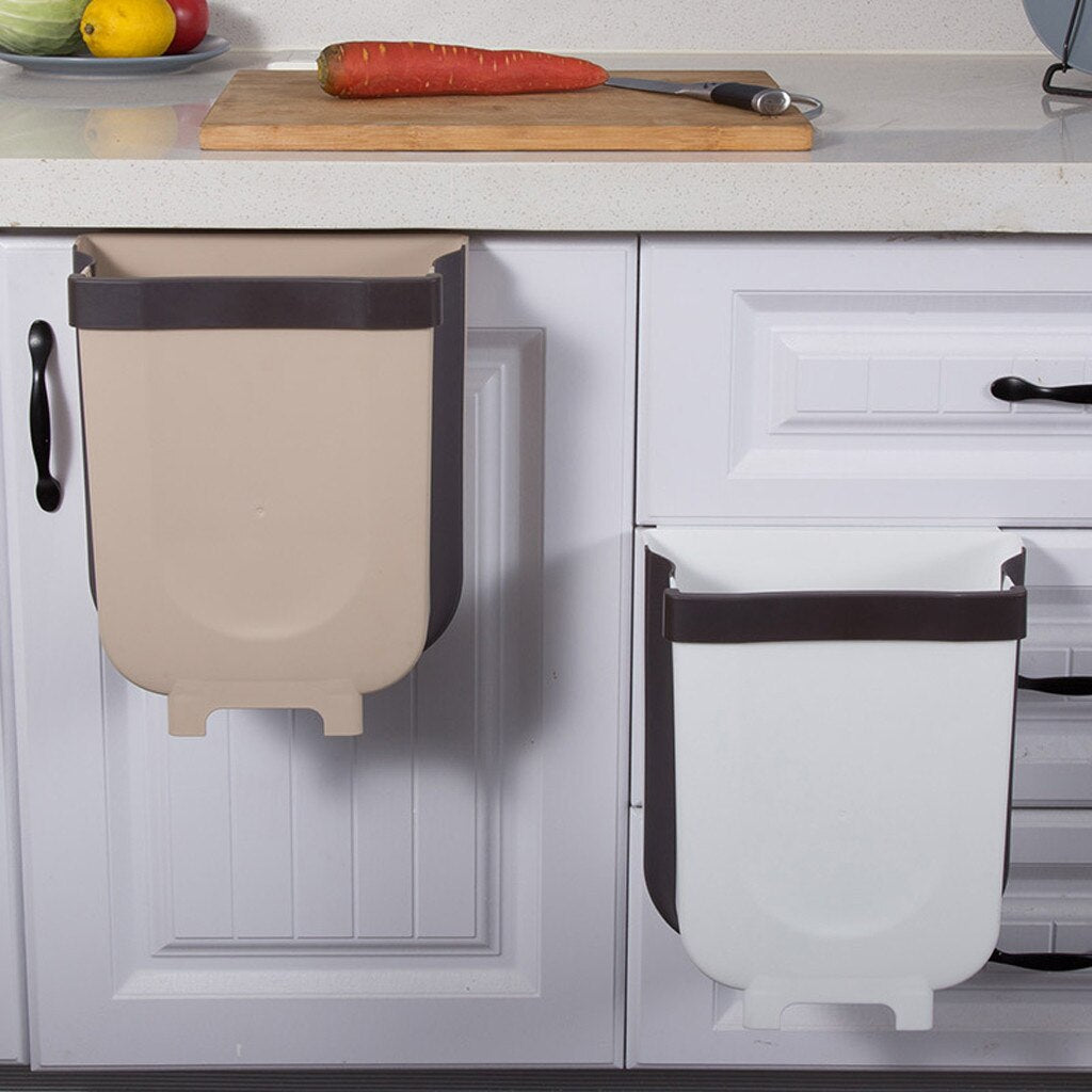 Brown and white 8L foldable trash bins hanging from kitchen cabinet doors