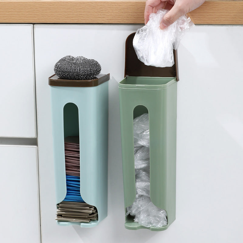 Green and blue wall-mounted reusable bag dispensers on kitchen tile