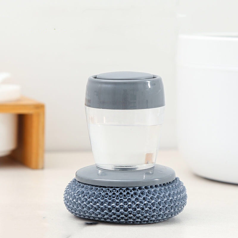 Gray soap-dispensing palm brush with mesh scrubbing surface